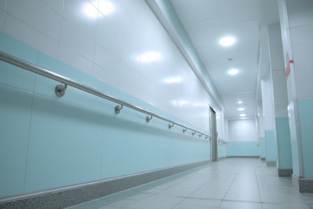 A well-lit hospital corridor with clear signage and a clean design ensures easy navigation for patients and visitors.の素材