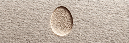 Pressed egg outline on soft textured recycled paper showcases innovative craftsmanship, perfect for eco-friendly art and decorative projects at home.の素材