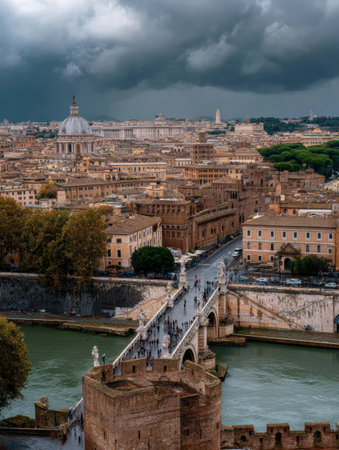 Vatican City stands prominently from Castel SantAngelo, with a dramatic cloudy sky framing the historic landscape of Rome during early evening.の素材