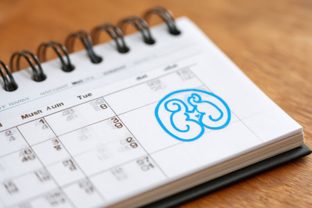Calendar shows kidney health awareness month with kidney symbol circled, inviting attention to the importance of kidney health and community support.の素材