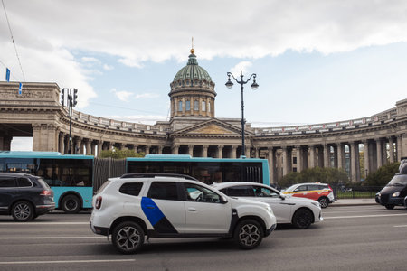Vehicles move along the street in front of Kazan Cathedral, a significant architectural site, under...
