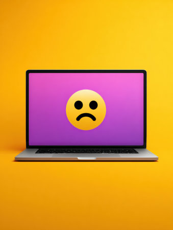 A laptop shows a website crash screen featuring a large frowning emoji on a vibrant purple background. The right zone remains unoccupied and clean.の素材