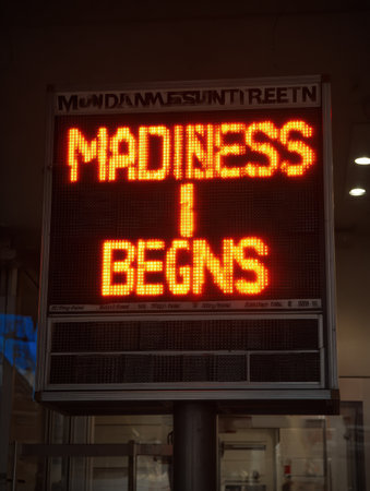 The brightly lit scoreboard signals the start of Madness Begins, igniting excitement and inviting attendees to join the festivities.の素材