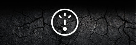 A cracked error icon hovers over a dark abstract background, which features a textured, cracked surface. The upper section remains clear and free of details.の素材
