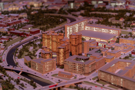 Intricate miniature representation of contemporary buildings and streets captures urban life at...
