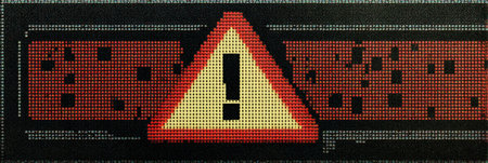 A digital pixelated warning icon featuring a yellow triangle and exclamation mark set against a black background, conveying an alert in a retro design.の素材