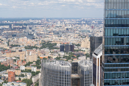 Expansive view of Moscow highlighting modern buildings and historical structures under a bright blue sky, capturing the city's vibrant urban life.の写真素材
