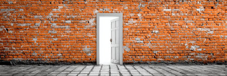 An open door stands in a brick wall, symbolizing a passage to new opportunities and experiences against a backdrop of permanence and barriers.の素材