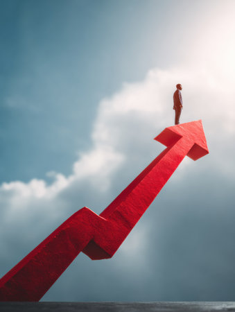 A man stands confidently on a large upward arrow, symbolizing business growth and success against a backdrop of clouds and light.の素材