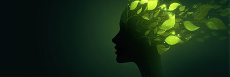 A glowing silhouette of a human head accompanied by vibrant leaves symbolizes healing and personal growth, thriving in a tranquil green ambiance.の素材