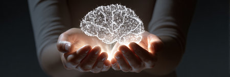 A glowing brain cradled in hands symbolizes support for mental wellness and the importance of daily mental health care.の素材