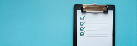 Motivational goal list displayed on a sleek clipboard with a bright blue background, offering ample copy space for future entries and reflections.の素材