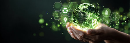 Hands cradle a glowing planet representing environmental awareness, surrounded by symbols of sustainability and renewable energy in a dark setting.の素材