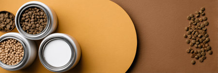 Arrangement of pet food supplies with containers filled with different types of kibble against a simple background, providing a neat and organized look.の素材
