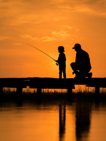 In a picturesque setting at sunset, a father and child bond over fishing on a quiet lake dock. Silhouettes reflect deep emotional connection and tranquility.の素材