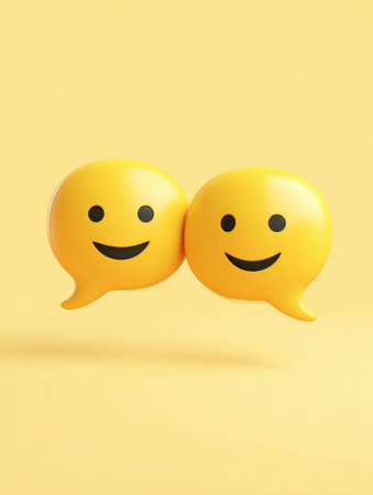Bright yellow speech bubbles with smiling emoji faces overlap, creating a playful and engaging visual for social interaction and conversation.の素材