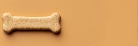 A single pet treat is placed in the center of a smooth, minimalistic background, highlighting its shape and texture, ideal for promotional content.の素材