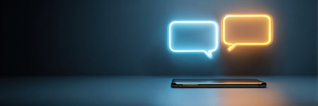 A smartphone sits on a surface with glowing speech bubbles above it, suggesting interaction in a soft, minimal background that enhances focus.の素材