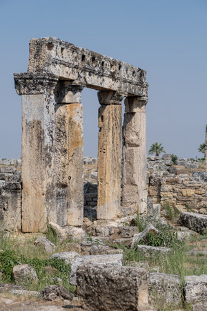 Explore the stunning ruins of Pamukkale, where ancient columns tell stories of civilizations that thrived in this now tranquil landscape.の写真素材