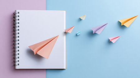 Colorful 3D paper rocket emerges from an open notebook, showcasing imagination against a soft pastel background perfect for artistic expression.の素材