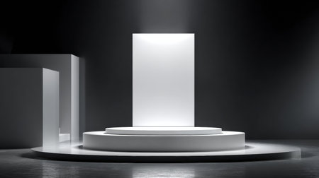Modern commercial stage with a circular 3D platform illuminated by soft lighting, accompanied by a large blank panel ready for promotional content.の素材