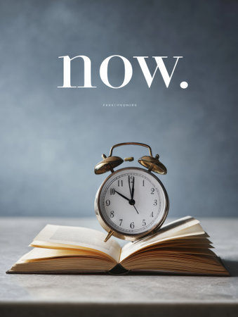 A clock with hands pointing at now stands on an open book, emphasizing the significance of present moment awareness and personal development.の素材
