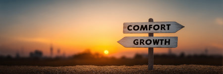 A beautiful sunrise illuminates a serene crossroads with directional signs labeled comfort and growth, symbolizing life choices and opportunities ahead.の素材