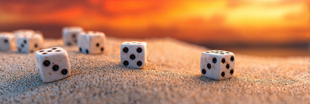Scattered dice rest on a golden sand dune as the sky lights up in vibrant hues during a surreal sunset with an empty expanse nearby.の素材