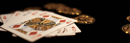 Poker hand reveals a winning combination with a golden flash on the cards and empty space beside, highlighting the excitement of the game.の素材