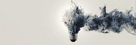 Ink splashes create a lightbulb silhouette on a blank canvas, showing creativity and abstraction in modern art. The upper margin remains minimal for impact.の素材