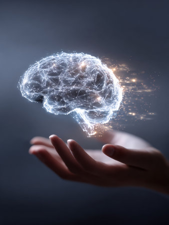 A luminous AI brain floats above an open hand, symbolizing the connection between human thought and advanced technology in a modern environment.の素材