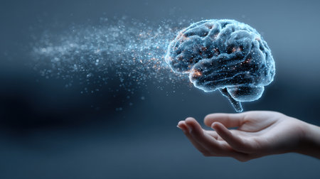 An advanced AI brain floats above a hand with digital particles emanating, set against a blurred background that fades into darkness on the right side.の素材