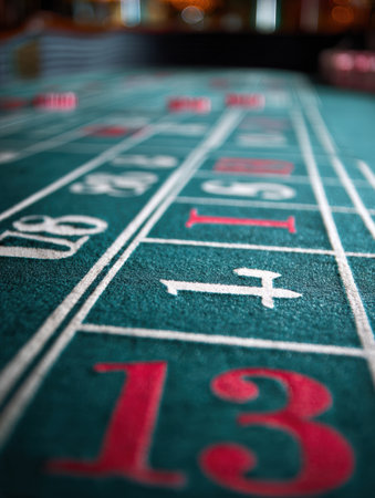 Close-up focus on craps table numbers showcasing key elements of gameplay strategy and vibrant colors found in a lively casino atmosphereの素材