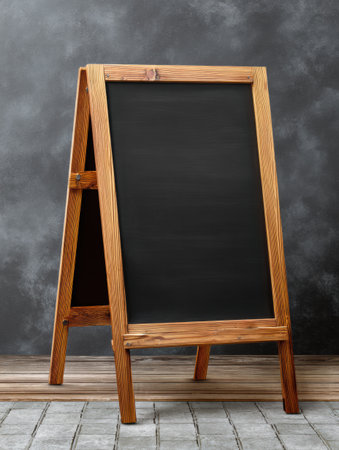 A stylish chalkboard menu board with a blank top area is perfect for displaying drink specials or daily menus, adding a charming touch to any coffee shop.の素材