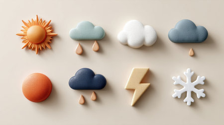 Various tactile weather-shaped items including sun, clouds, rain, lightning, and snowflake arranged artistically on a light background.の素材