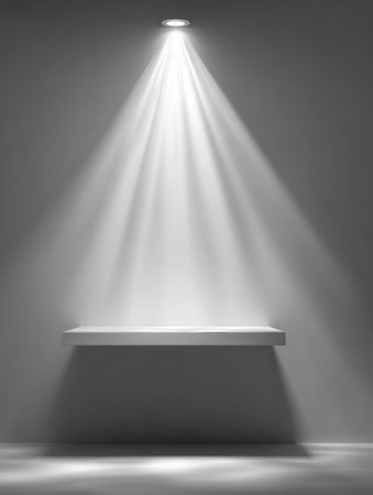 Soft beams of light spill onto a simple shelf, creating a serene atmosphere in a minimalist room with a modern design.の素材
