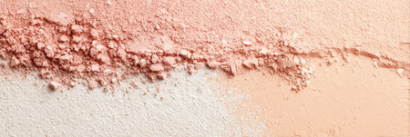 Textured powder in soft tones of pink and peach creates a visually pleasing composition, highlighting the gentle transitions between colors and materials.の素材