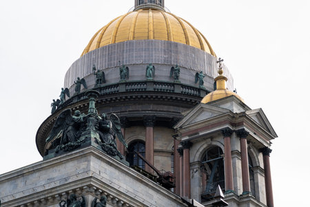 St. Isaacs Cathedral in Saint Petersburg showcases its golden domes and intricate sculptures, reflecting its beauty and historical significance.の写真素材