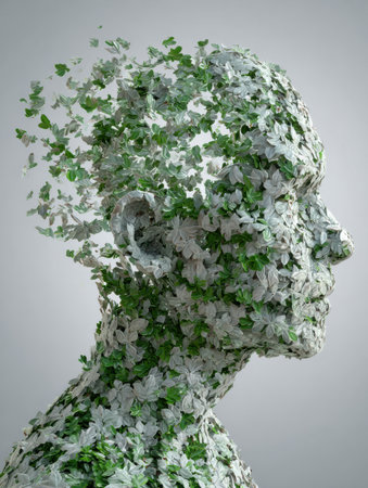 Sculptural representation of a human head composed of leaves and flowers illustrates the harmonious relationship between nature and people in a creative mannerの素材
