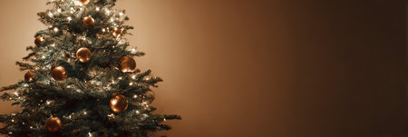 A beautifully adorned Christmas tree stands adorned with shining golden ornaments and warm white lights, creating a cozy holiday atmosphere in a room.の素材