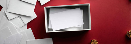 An assortment of blank cards is neatly organized in a box, surrounded by additional cards and decorative items, perfect for crafting or note-taking.の素材