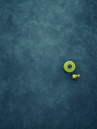 A bright yellow submersible explores the ocean floor, surrounded by deep blue waters, capturing the essence of underwater adventure during the day.の素材