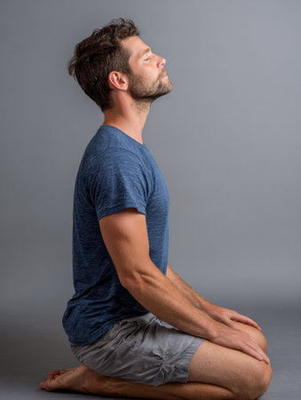 Individual in a seated position demonstrates box breathing steps to promote relaxation and mindfulness through controlled breathing techniques.の素材
