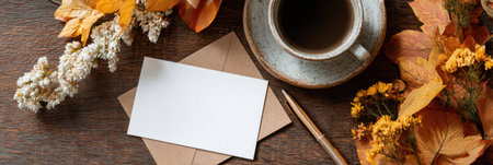 A cozy autumn setting featuring a blank gratitude card, a pen, a steaming coffee cup, and colorful leaves on a rustic wooden table, inviting reflection.の素材