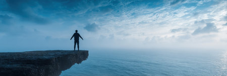 A figure stands confidently at the edge of a cliff, facing the vast ocean. The twilight sky is filled with soft clouds and serene colors.の素材