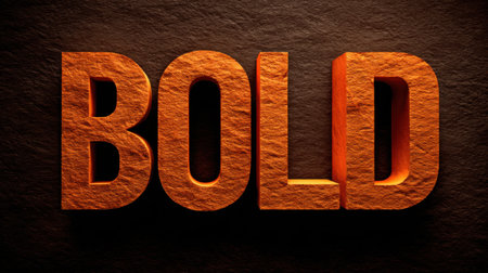 Bold letters in bright orange stand out dramatically against a dark background, showing eye-catching typography ideal for graphic design projects.の素材