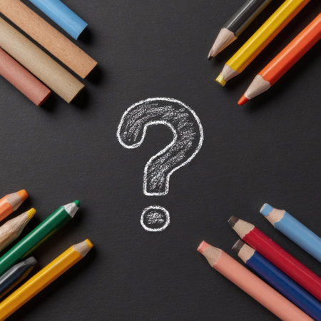 Colorful pencils and chalk pieces are arranged around a bold question mark drawn on a black surface. The scene invites curiosity and creativity.の素材