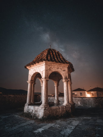 Ancient well with stone arches stands under a starry sky, showcasing the Milky Way in a serene village, evoking a sense of wonder and history.の素材