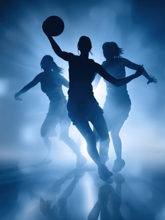 Three basketball players are captured in motion, their silhouettes highlighted against a bright background, creating a lively and energetic scene.の素材
