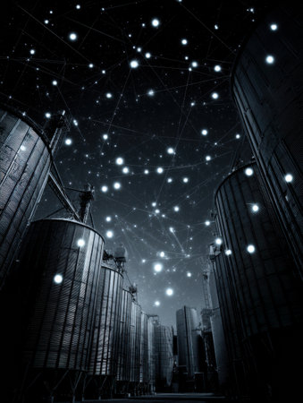 Grain silos stand silently under a clear night sky filled with sparkling stars, creating a serene and magical atmosphere in rural surroundings.の素材